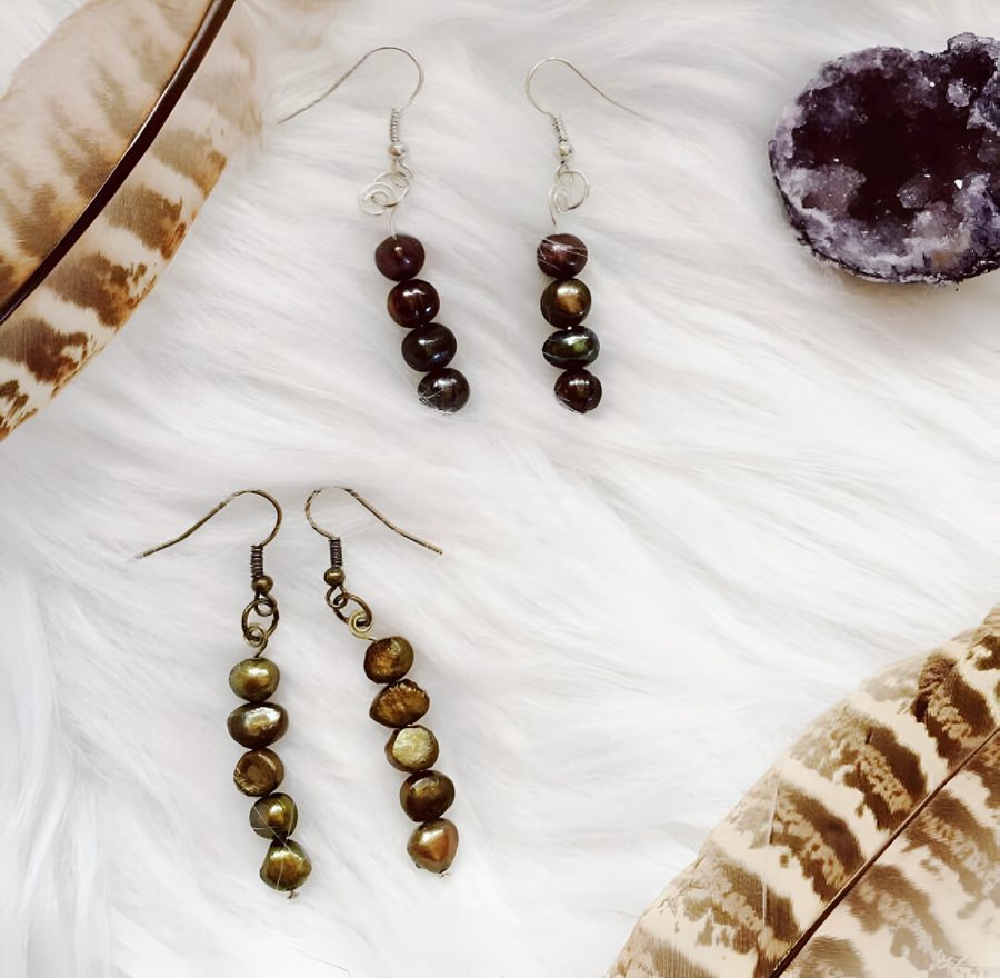 Handmade beaded earrings with feather accents